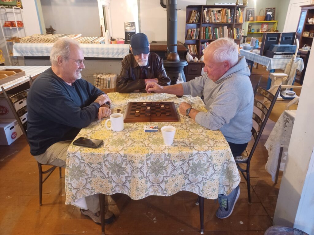 Men playing checkers at the South Tunnel General Store